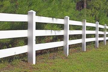 a white vinyl fence